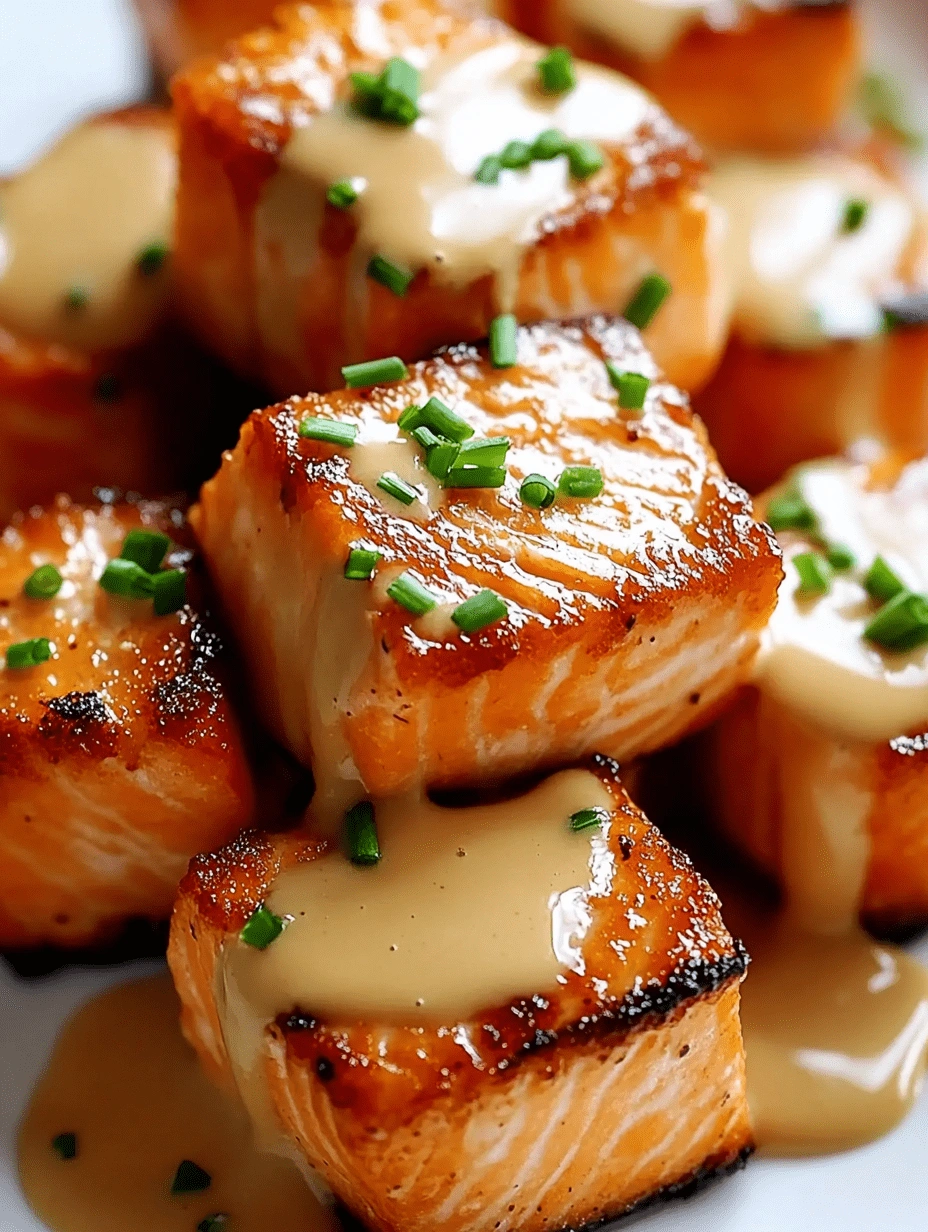 Close-up of crispy salmon bites topped with Bang Bang sauce and fresh chopped chives