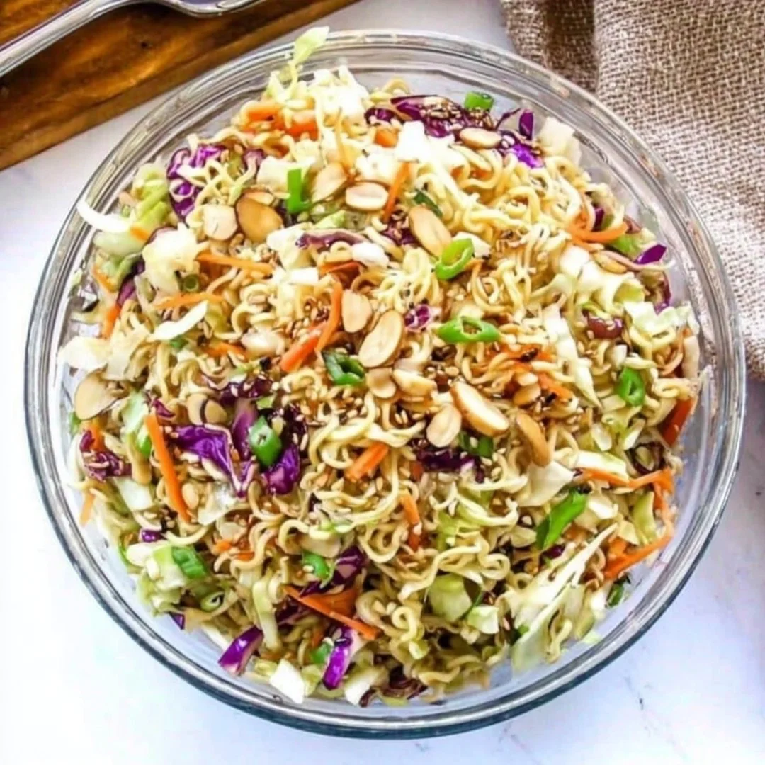 Pioneer Woman's flavorful ramen noodle salad served in a bowl with vegetables