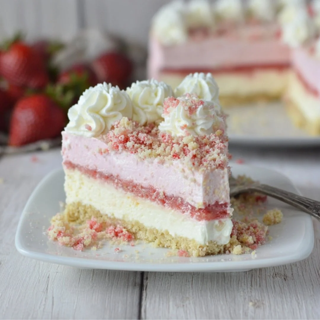 Strawberry Crunch Cheesecake with a crunchy topping and fresh strawberries on the side